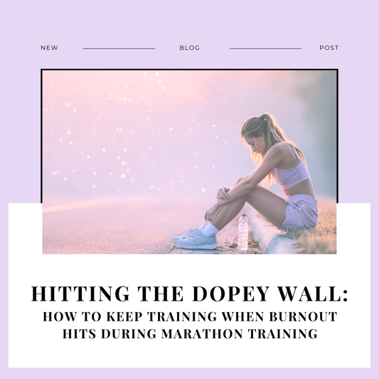 Runner sitting on the side of a quiet road at sunrise, pausing to rest during marathon training, symbolizing burnout during marathon prep